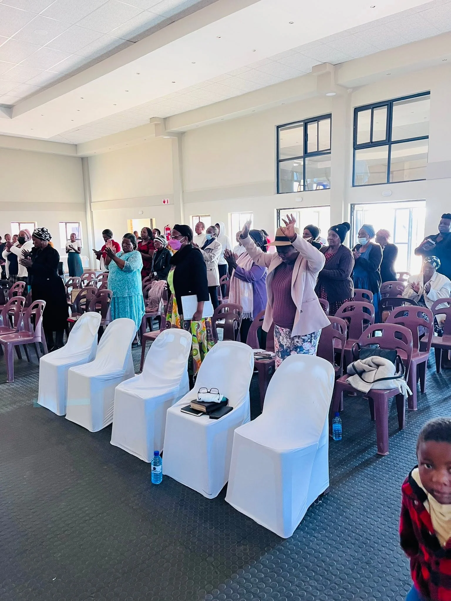 Congregation worshipping together inside the church